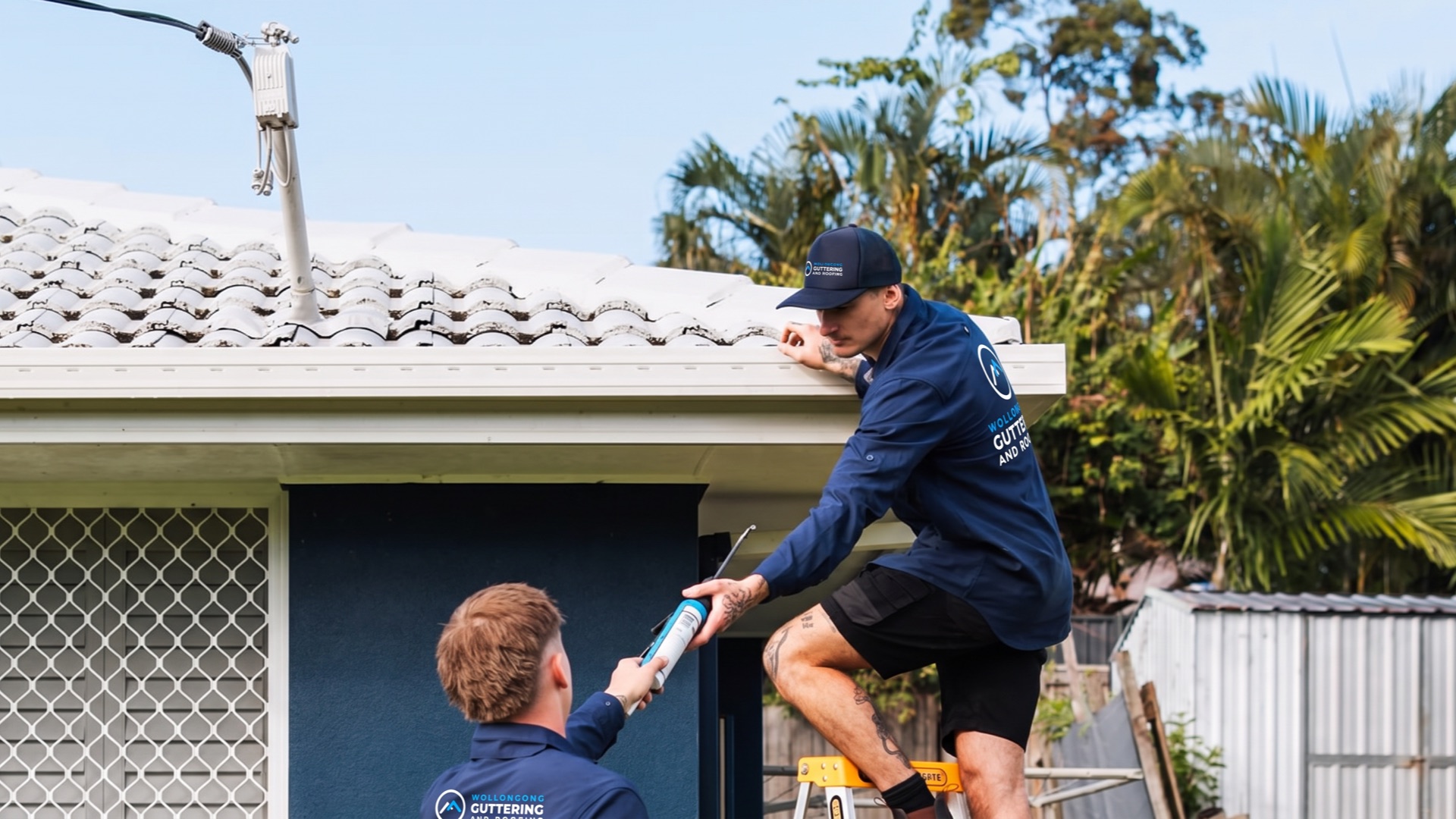 Roofer working on fascia and flashing
