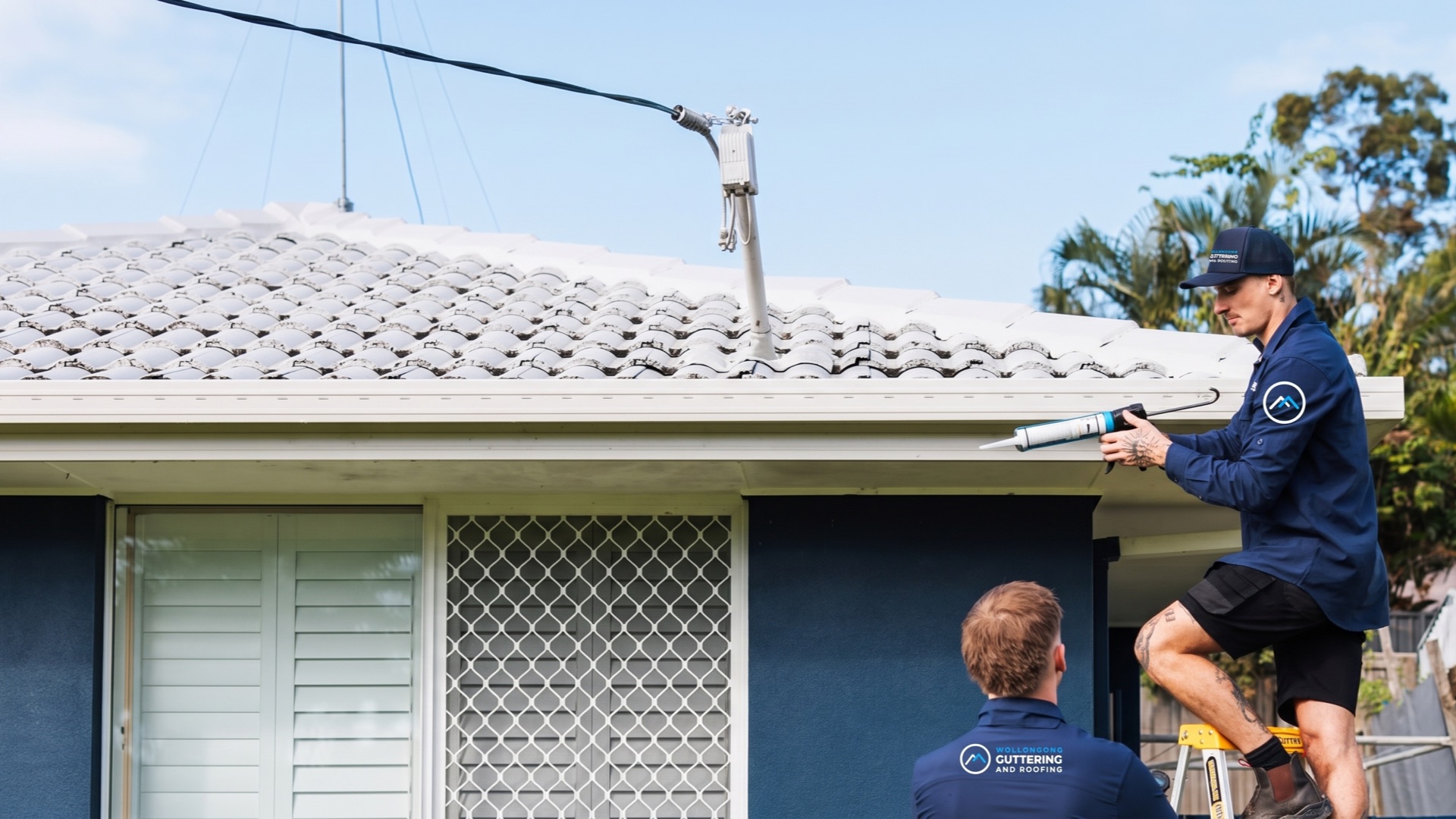 Roofer working on a gutter line
