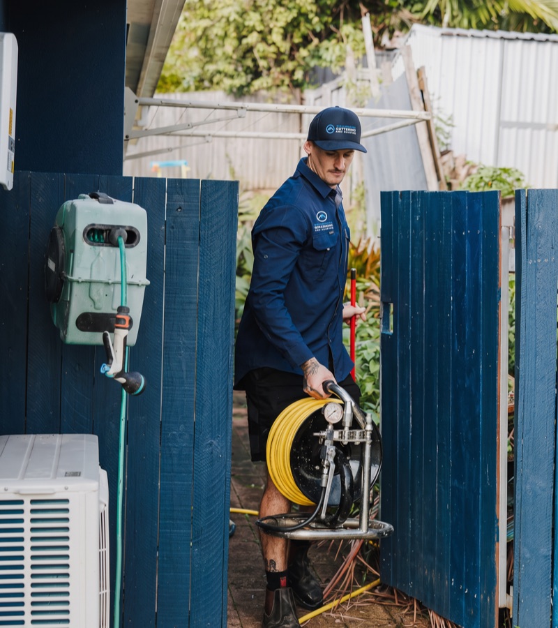 Roofer carrying tools for storm damage repair